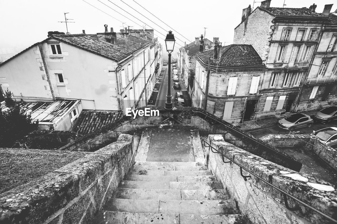 High angle view of steps against buildings in city