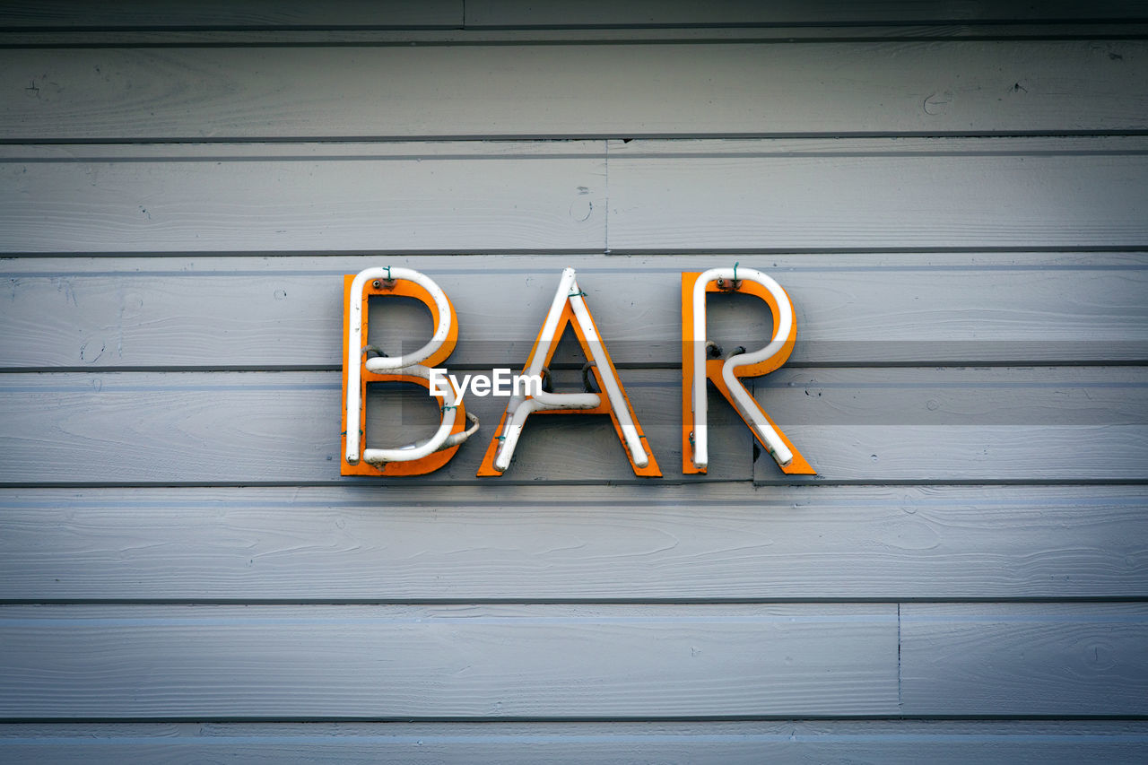 Close-up of bar text on wood