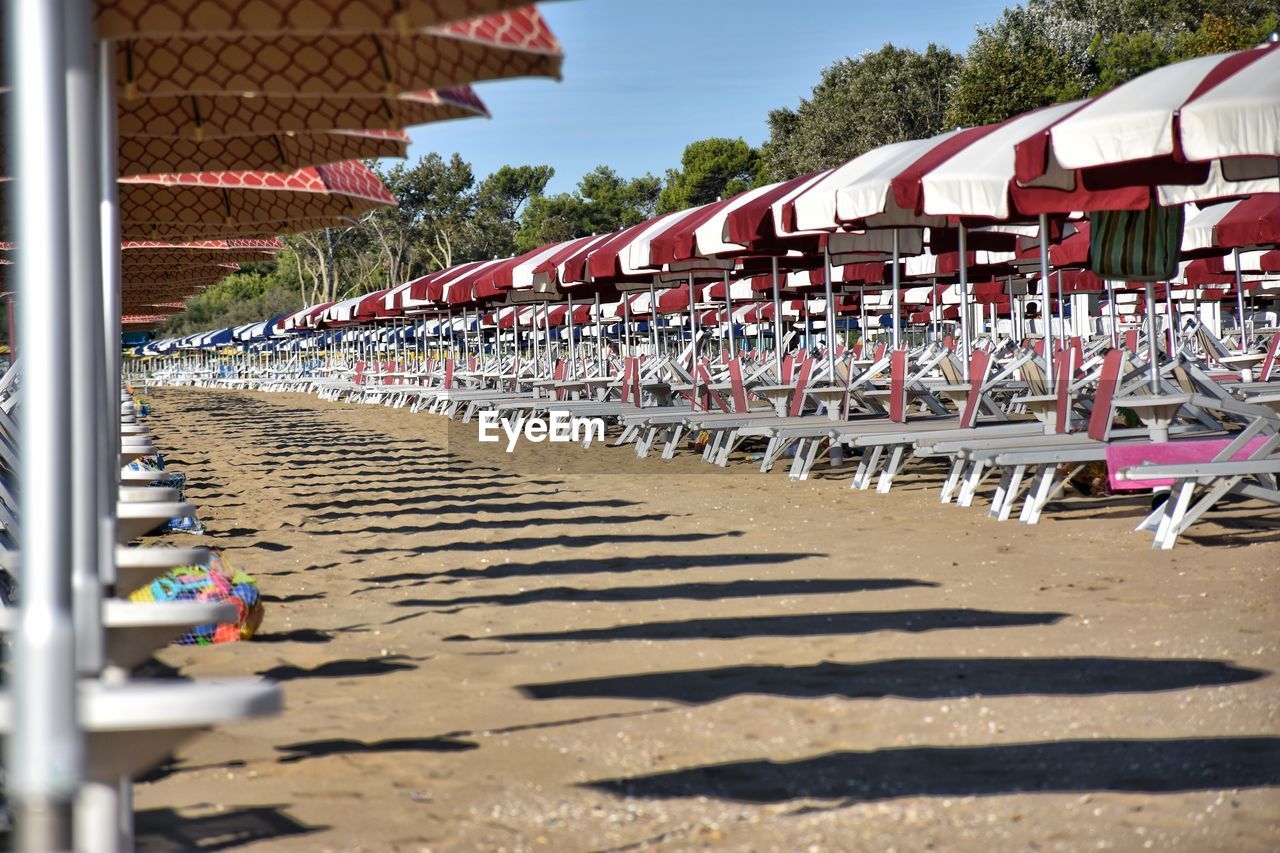 Group of people on beach against buildings