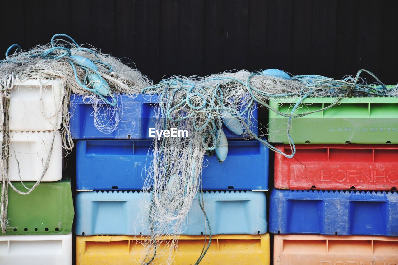Buoys and fishing nets on colorful crates