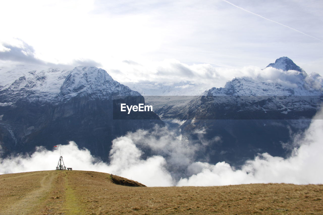 Scenic view of snowcapped mountains against sky