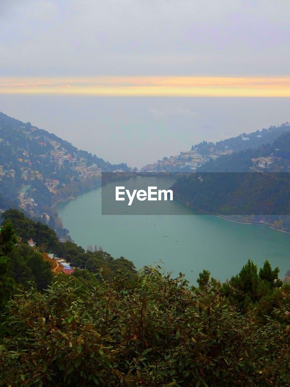 Scenic view of mountains against cloudy sky