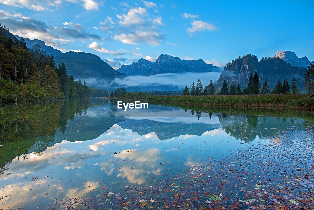 Scenic view of lake and mountains against sky