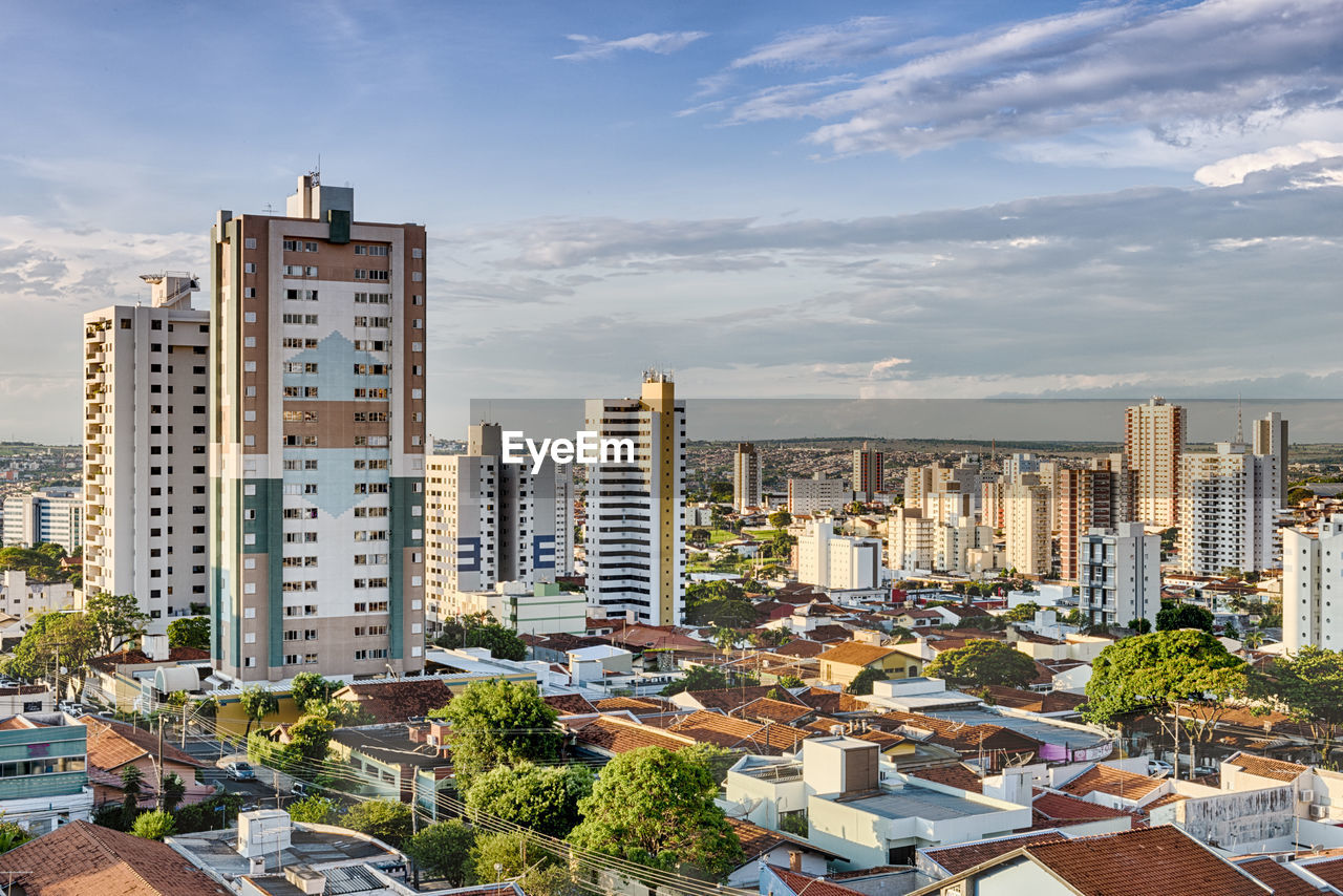 Modern buildings in city against sky