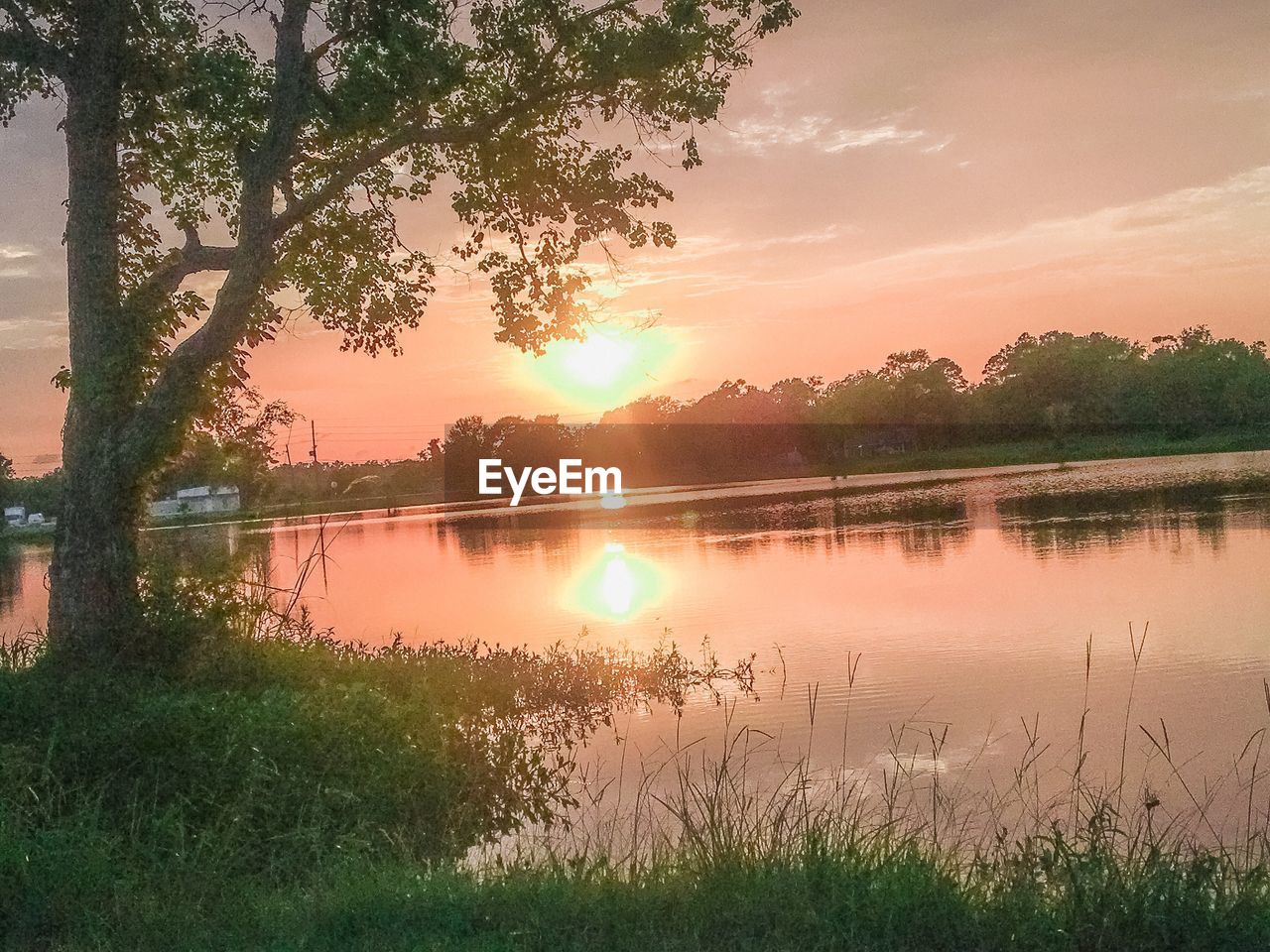 SCENIC VIEW OF LAKE DURING SUNSET