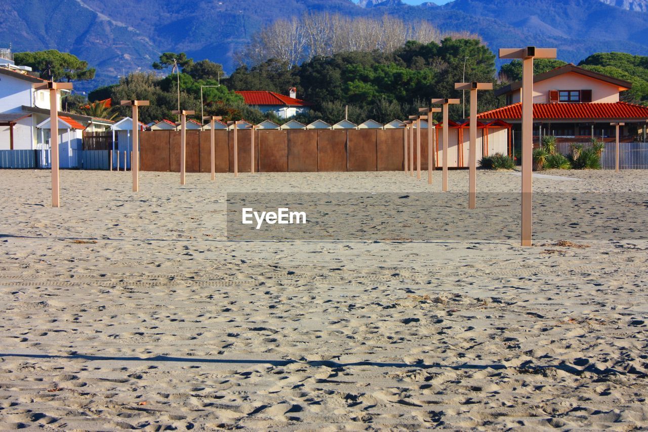 SCENIC VIEW OF BEACH BY HOUSES