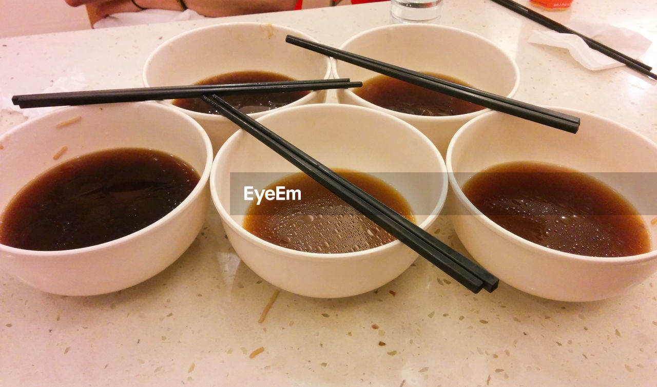 High angle view of soup served in bowls on table