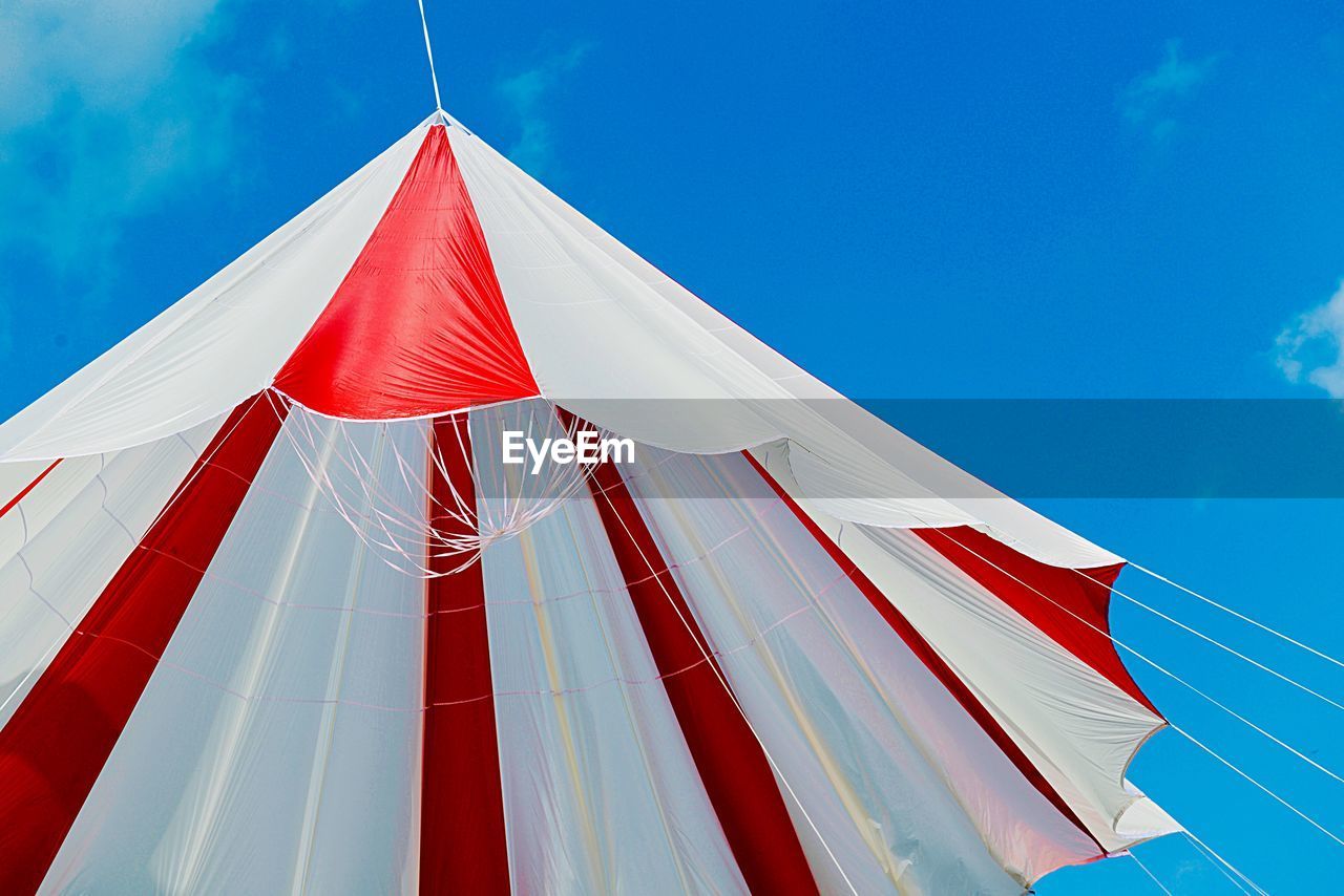 LOW ANGLE VIEW OF FLAGS AGAINST SKY