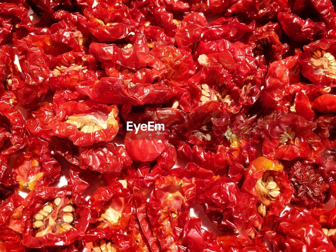 Full frame shot of dry tomatoes on sunny day