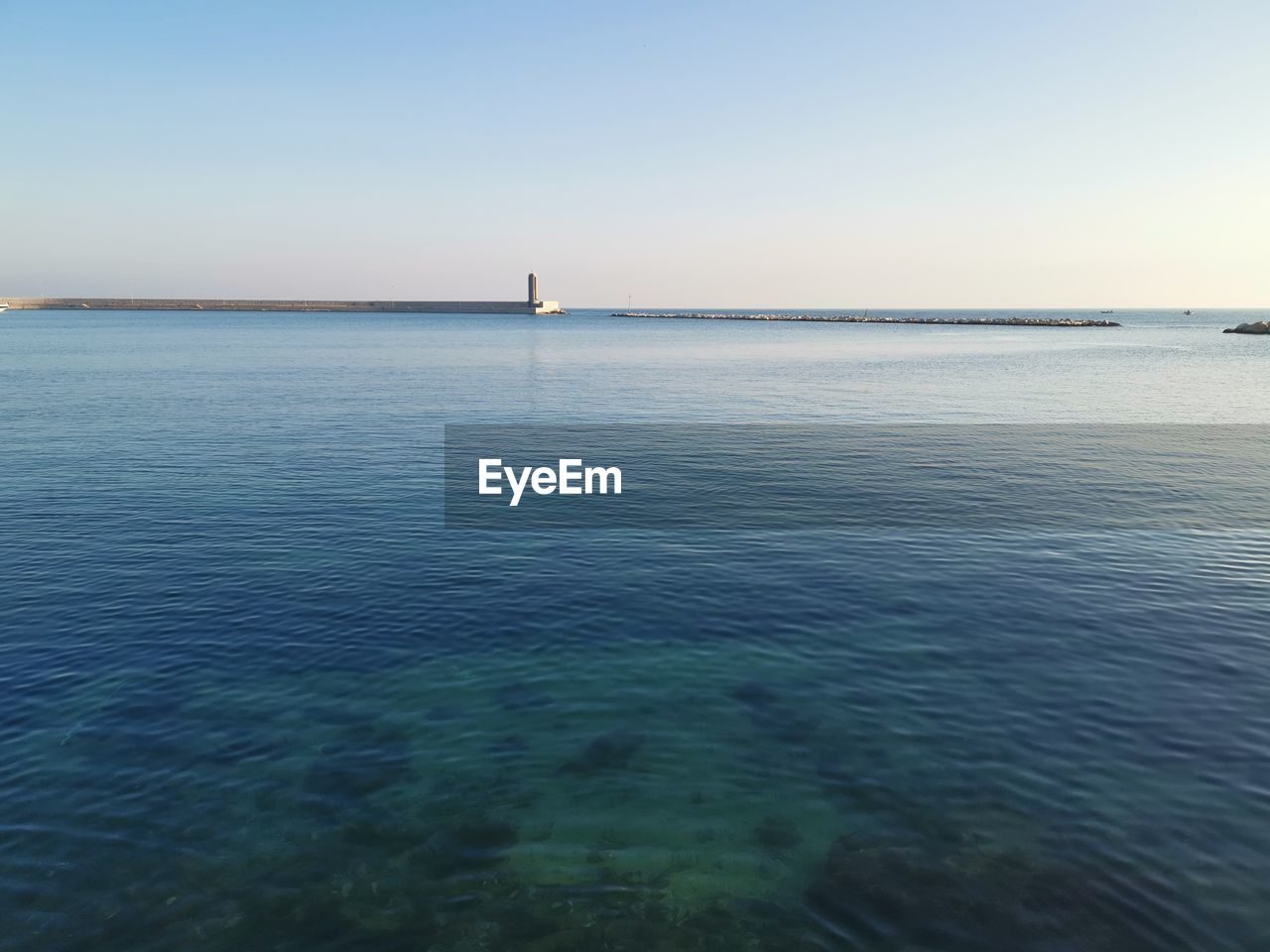 Scenic view of sea against clear sky