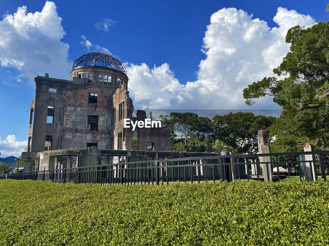 architecture, sky, plant, built structure, château, nature, building exterior, cloud, history, the past, building, travel destinations, tree, grass, landscape, travel, flower, land, no people, green, castle, blue, estate, outdoors, field, rural area, tourism, day, environment, religion