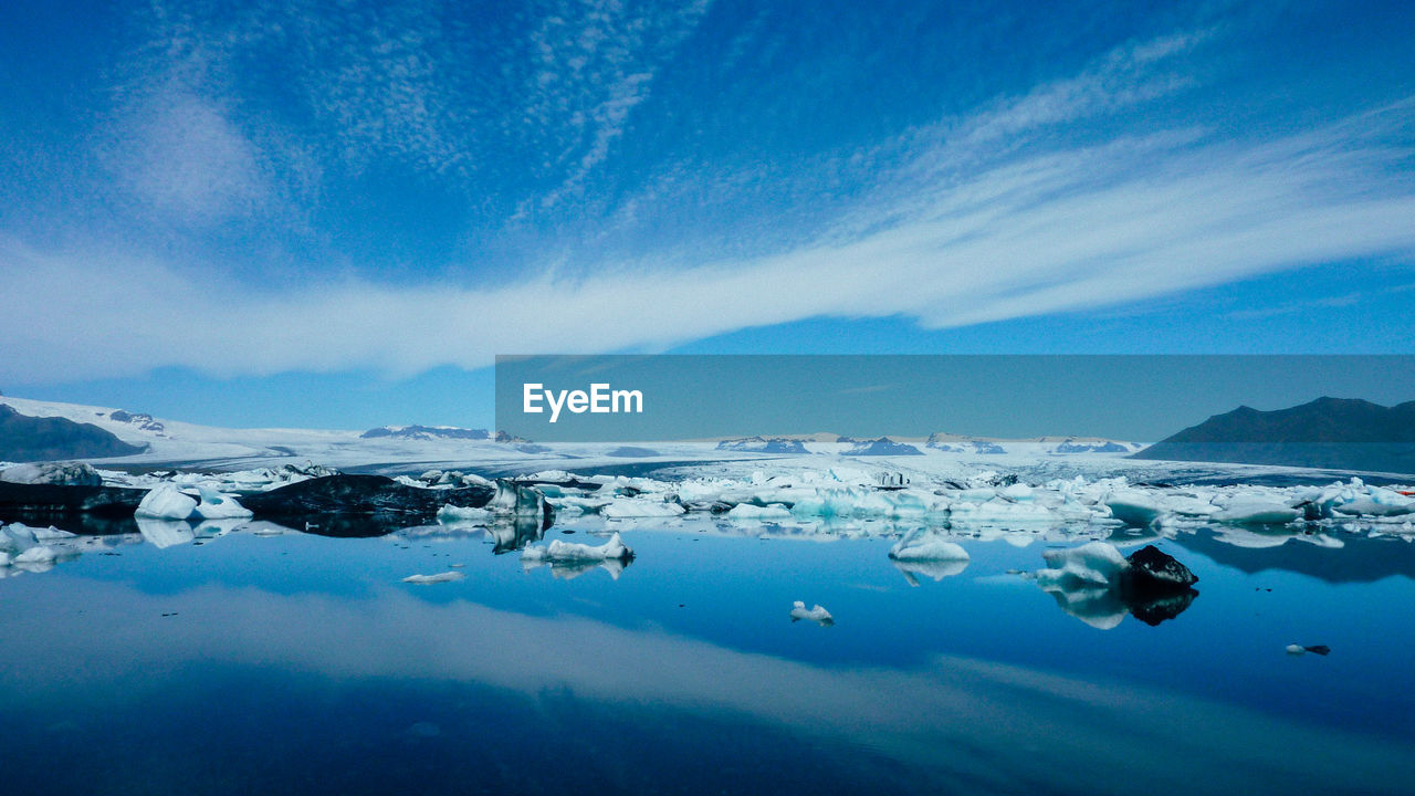 Scenic view of icelandic glacier lake against sky