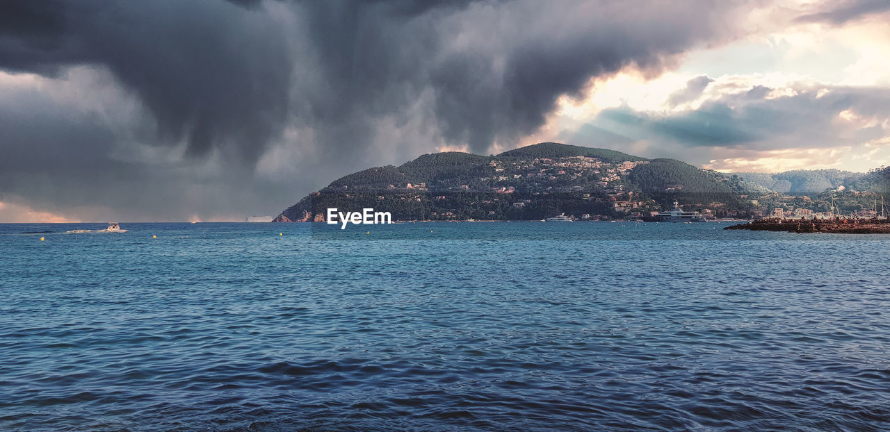 water, cloud, sky, sea, beauty in nature, scenics - nature, mountain, nature, environment, storm, travel destinations, architecture, landscape, horizon, ocean, dramatic sky, land, city, no people, outdoors, travel, storm cloud, panoramic, coast, beach, wave, building, thunderstorm, building exterior, dusk, tourism