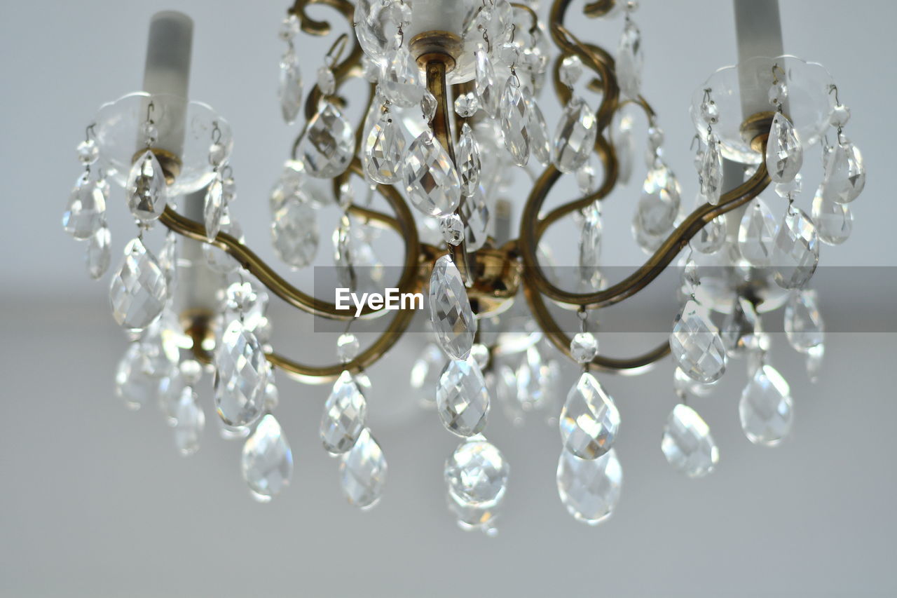 Low angle view of chandelier hanging at ceiling