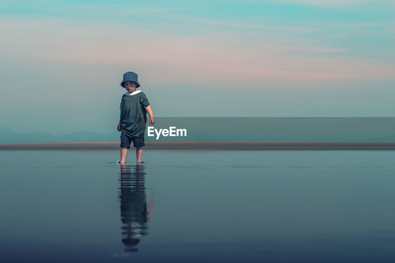 Child walking through water