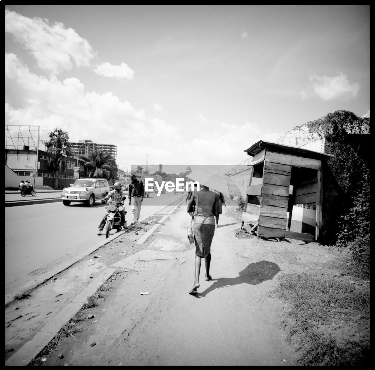 In the streets of Kampala 120 Mm Analogue Photography Architecture Cityscape Election Uganda Goats Lomography Motorcycle Rails Streets Of Kampala Travel Uganda  Umbrella In Africa Adventure Black And White East Africa Election Campaign Girl With Umbrella Kampala Kampala,uganda Marabu Medium Format People Urban