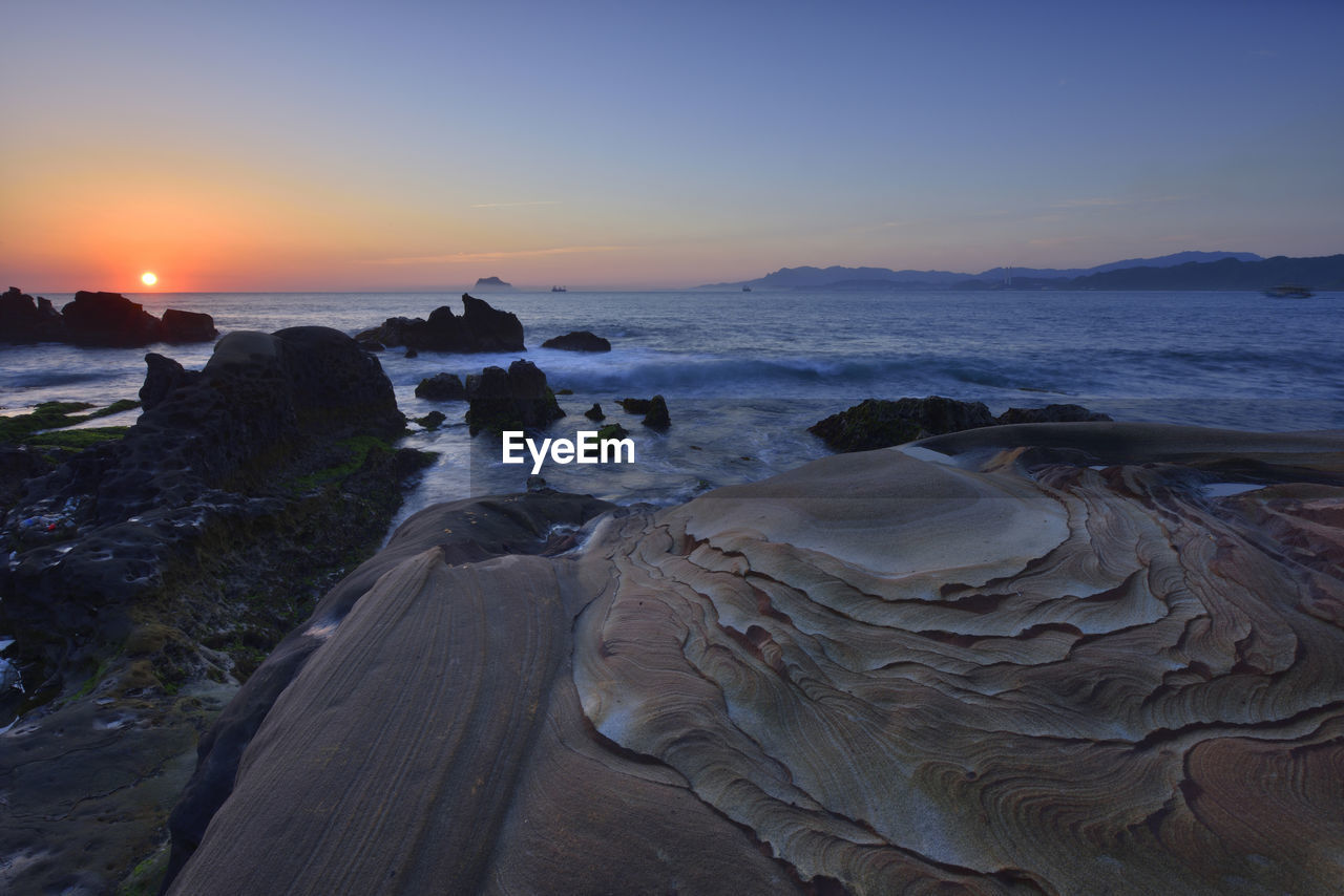 Scenic view of sea during sunset