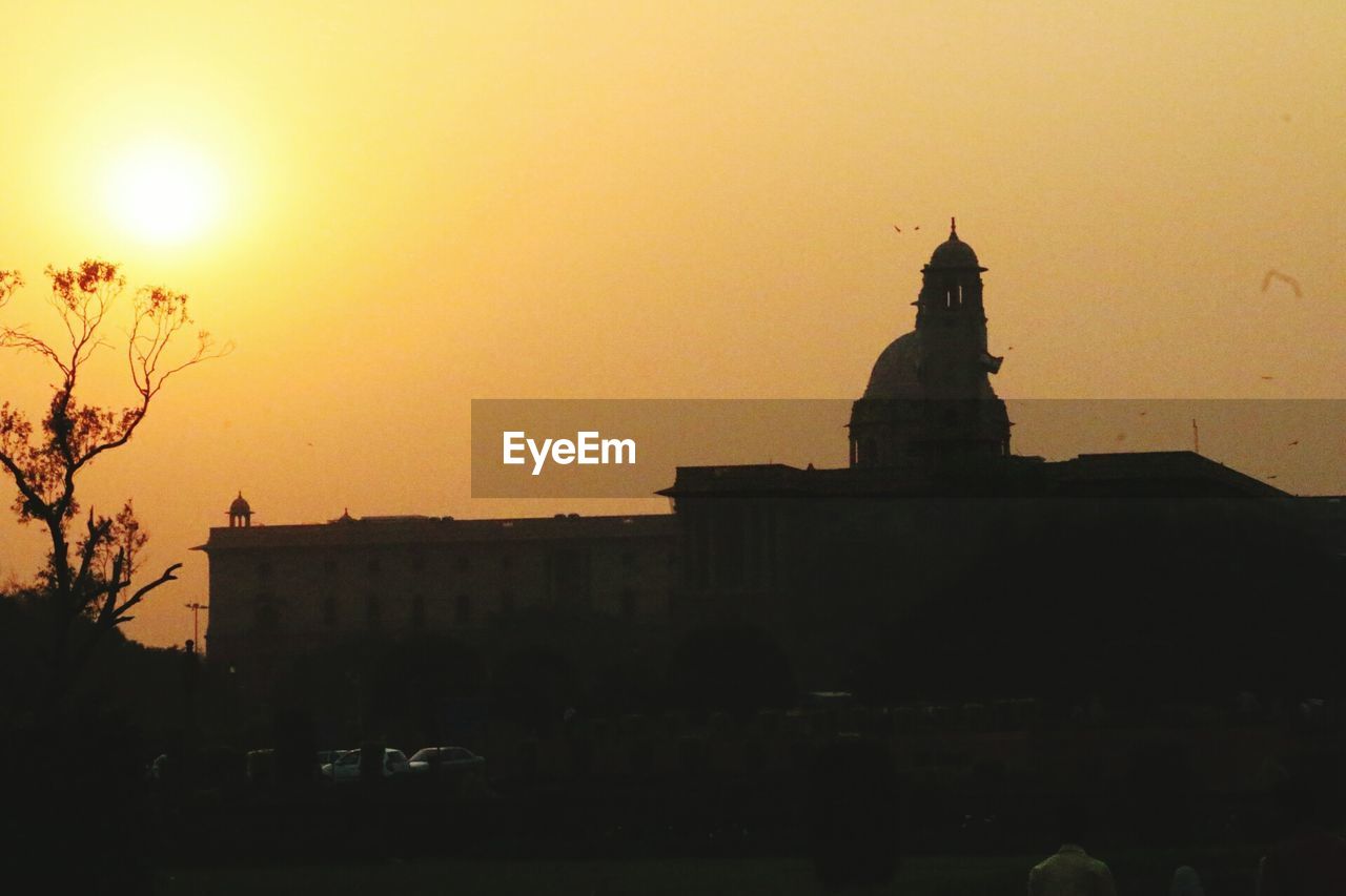 VIEW OF BUILDINGS AT SUNSET