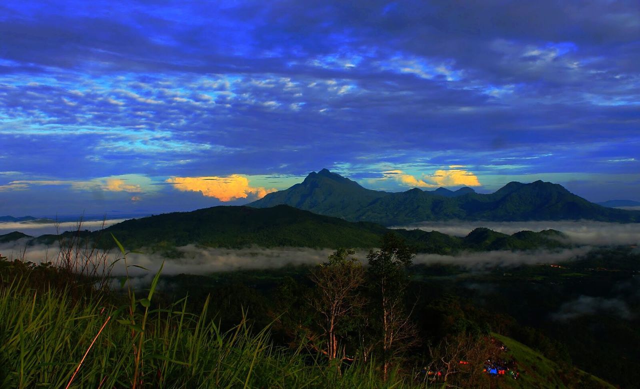 Scenic view of mountains against purple sky