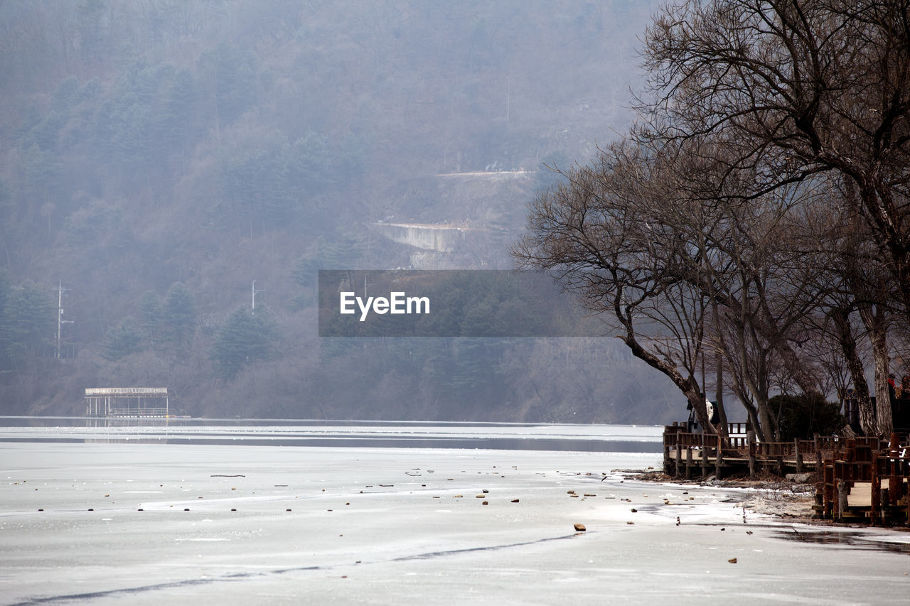 Scenic view of frozen lake against mountain