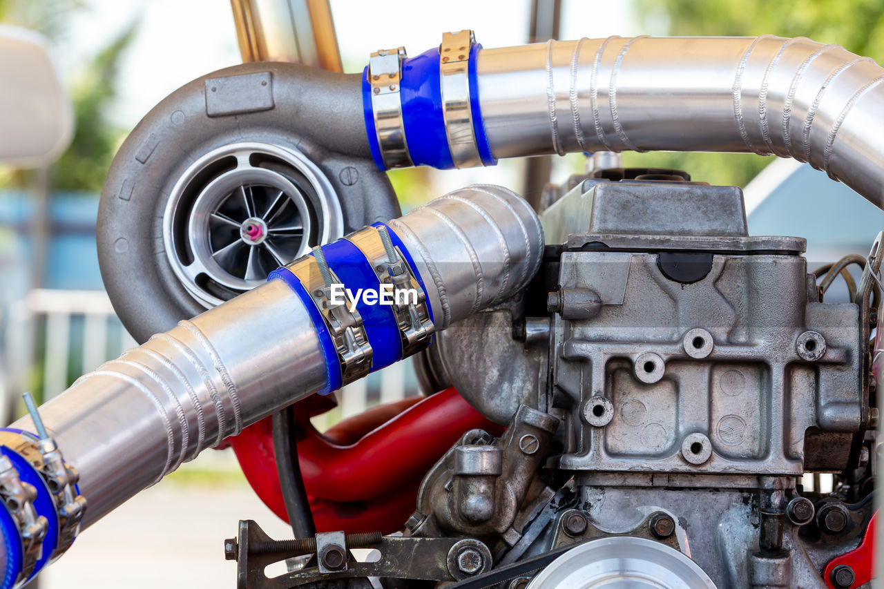 Car turbocharger on car engine, auto part turbo engine technology.