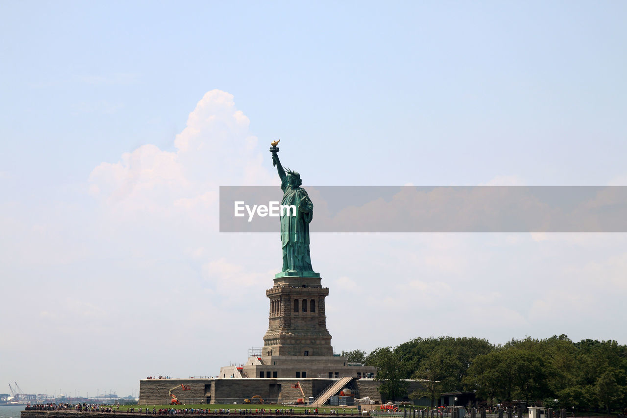 Low angle view of statue against sky