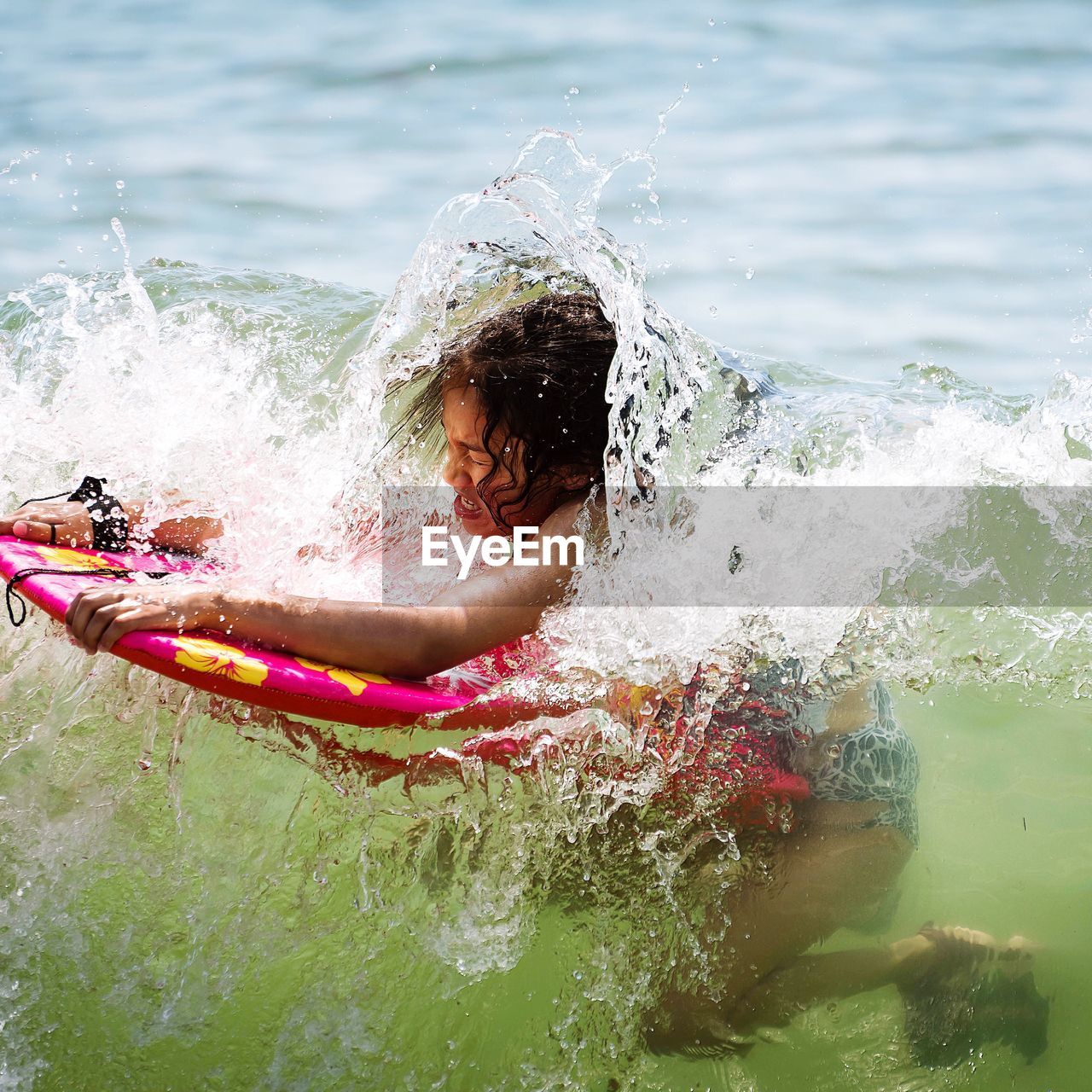 Girl surfing in sea