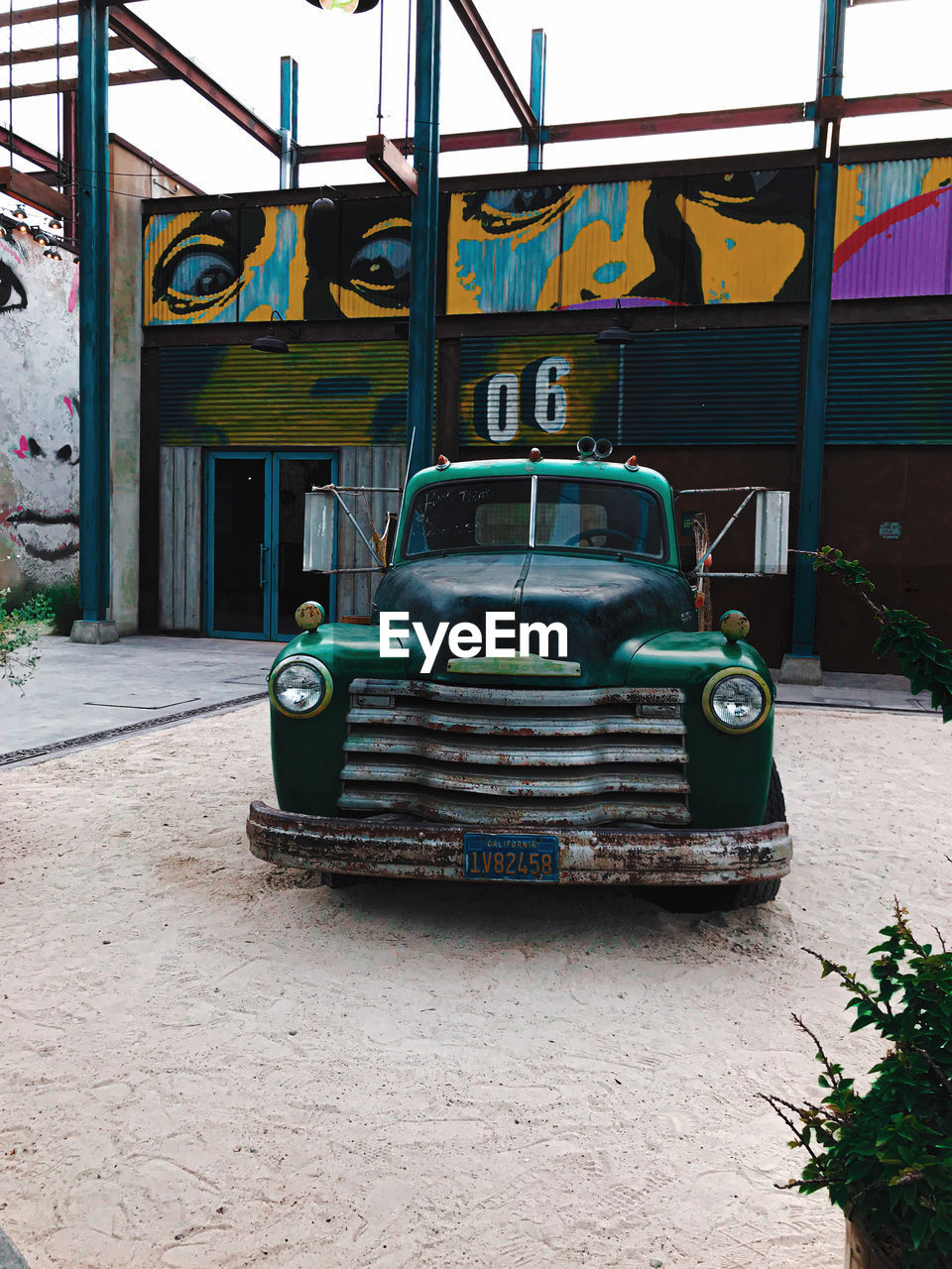 VIEW OF CAR ON STREET IN CITY