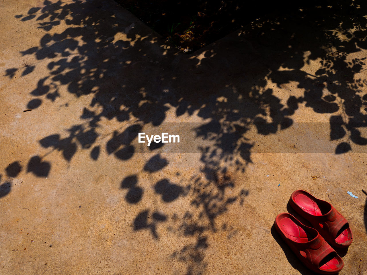 High angle view of shoes on sand