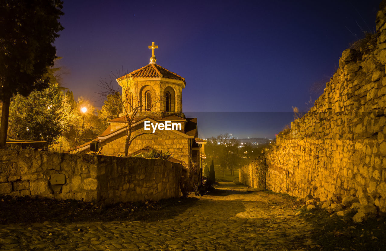 Illuminated historic building against sky at night