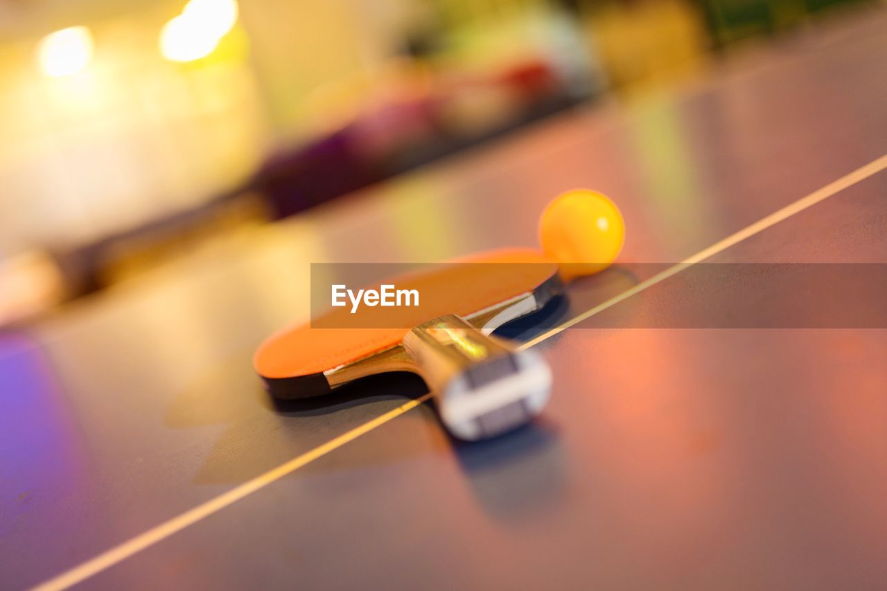 Close-up of ball and racket on table tennis