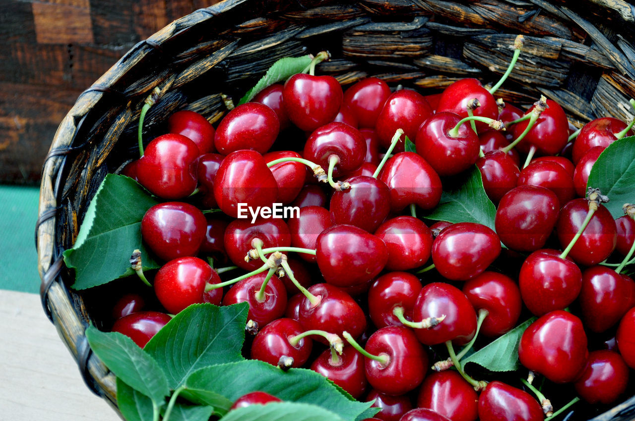 Fresh red cherries in a basket