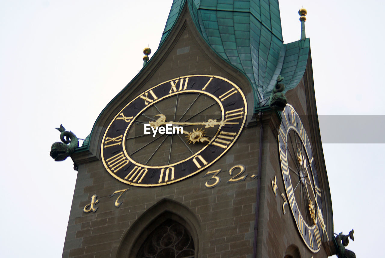 clock, time, architecture, clock tower, tower, built structure, building exterior, clock face, travel destinations, roman numeral, building, low angle view, no people, history, sky, the past, wall clock, minute hand, travel, nature, city, day, clear sky, space, astronomy, astronomical clock, outdoors, tourism