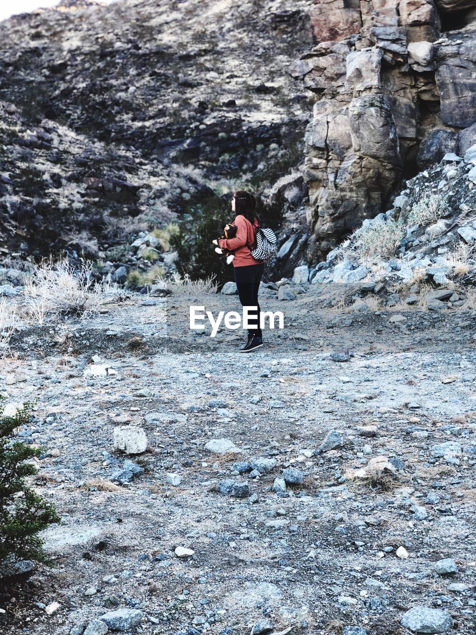 FULL LENGTH OF MAN STANDING ON ROCKS