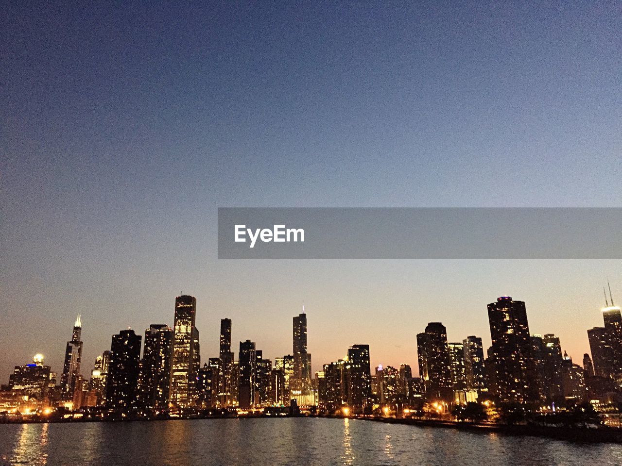 ILLUMINATED CITYSCAPE AT NIGHT