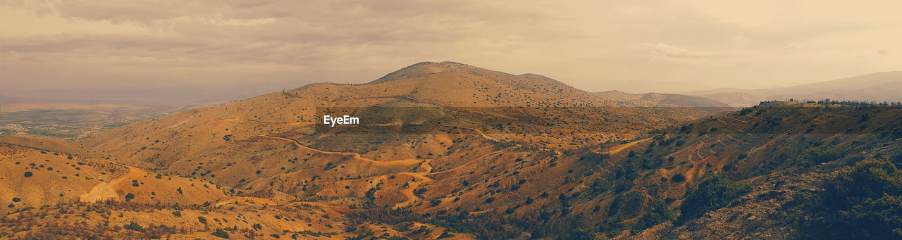 Scenic view of mountains against sky during sunset