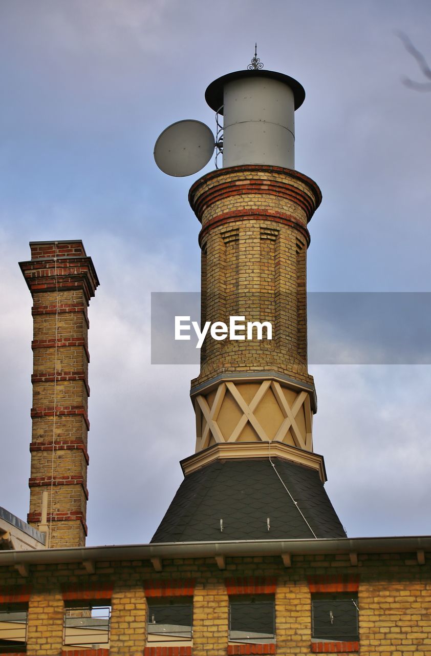 Low angle view of chimney against sky