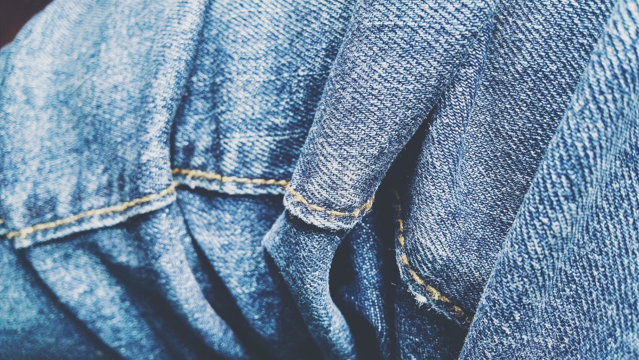 Close-up of person wearing jeans