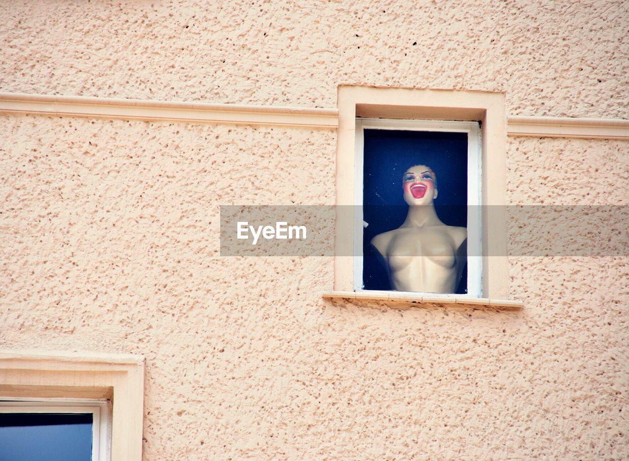 Dummy seen through window