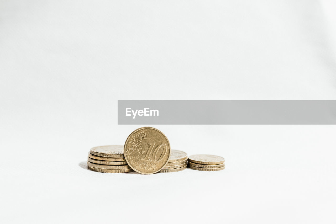 Close-up of coins on white background