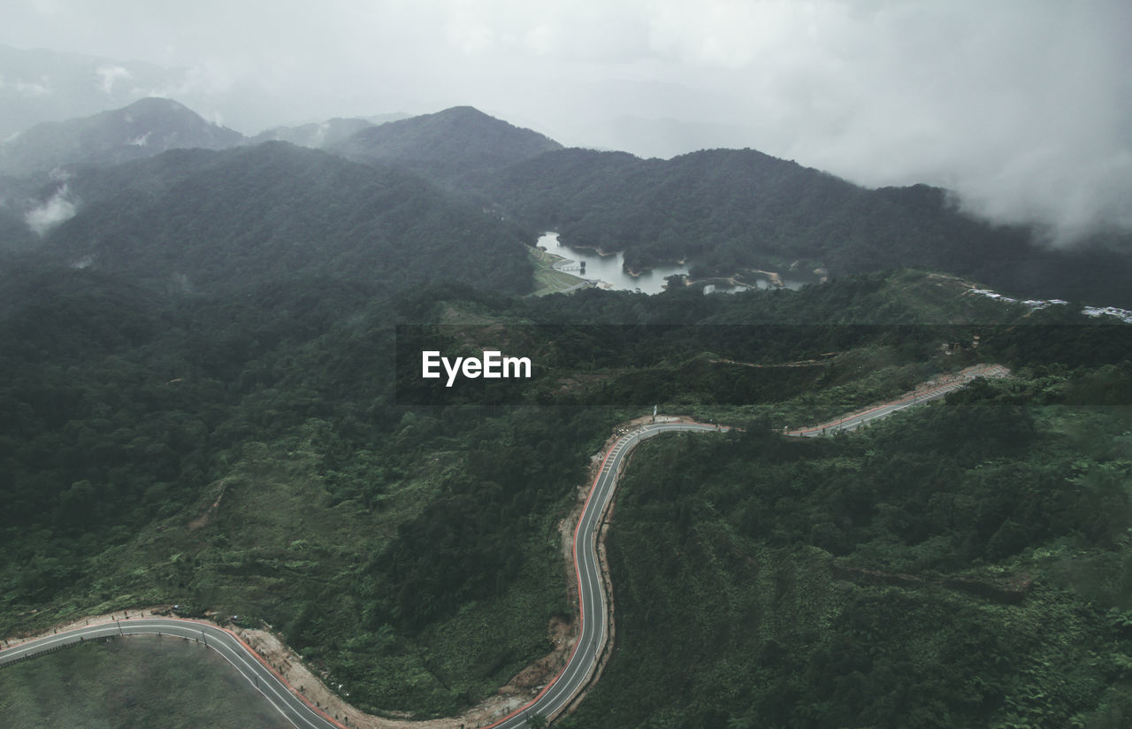 High angle view of road amidst mountains against sky