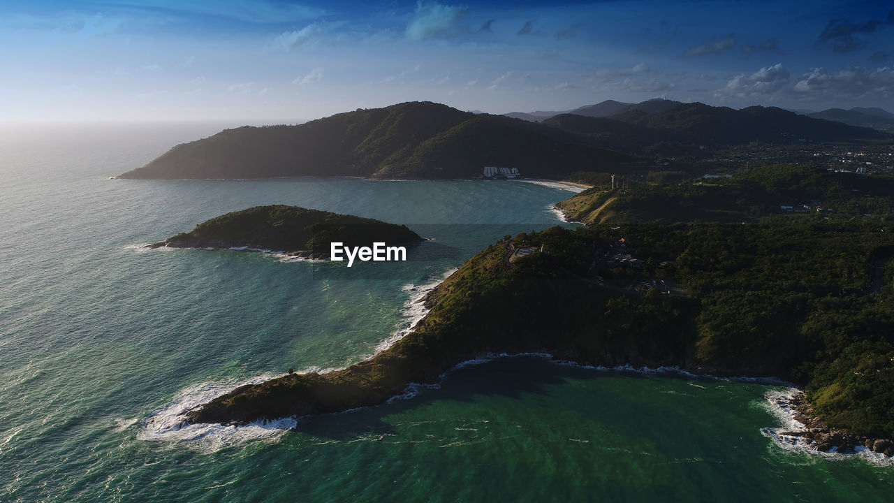 Aerial view of seashore against sky