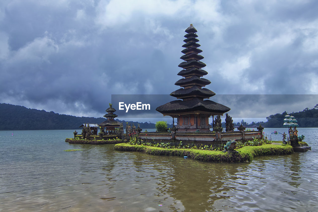 Unique architectural design of a floating tample at bratan lake inspired by balinese hinduism