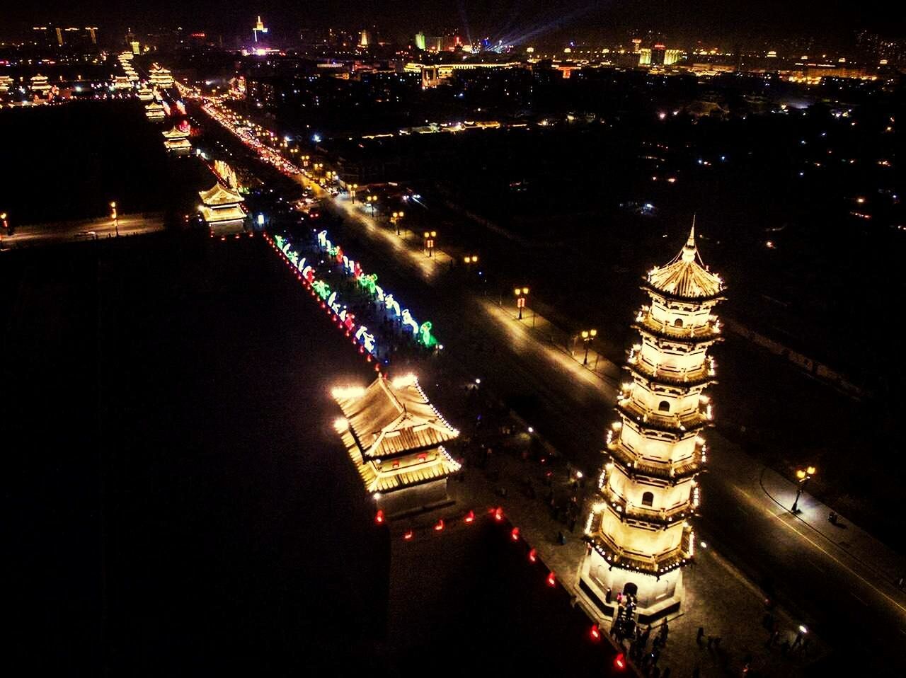 HIGH ANGLE VIEW OF CITY AT NIGHT