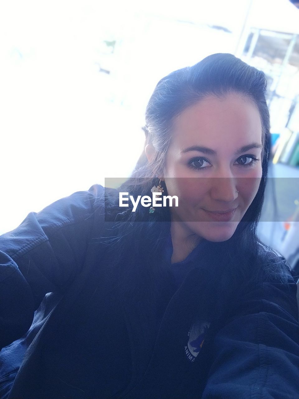 blue, adult, portrait, women, young adult, one person, person, looking at camera, indoors, headshot, smiling, human face, female, lifestyles, lying down, looking, emotion, happiness, relaxation, casual clothing, front view, photo shoot, nature, men, copy space