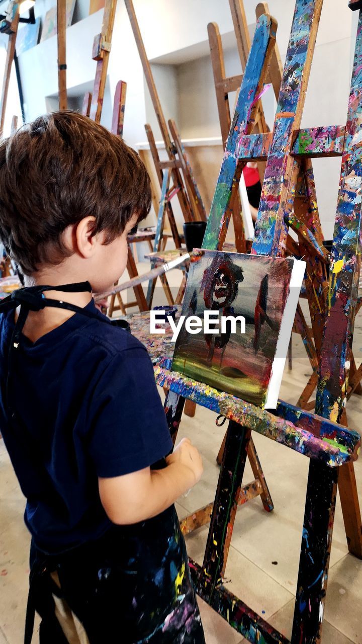 Boy painting artist canvas
