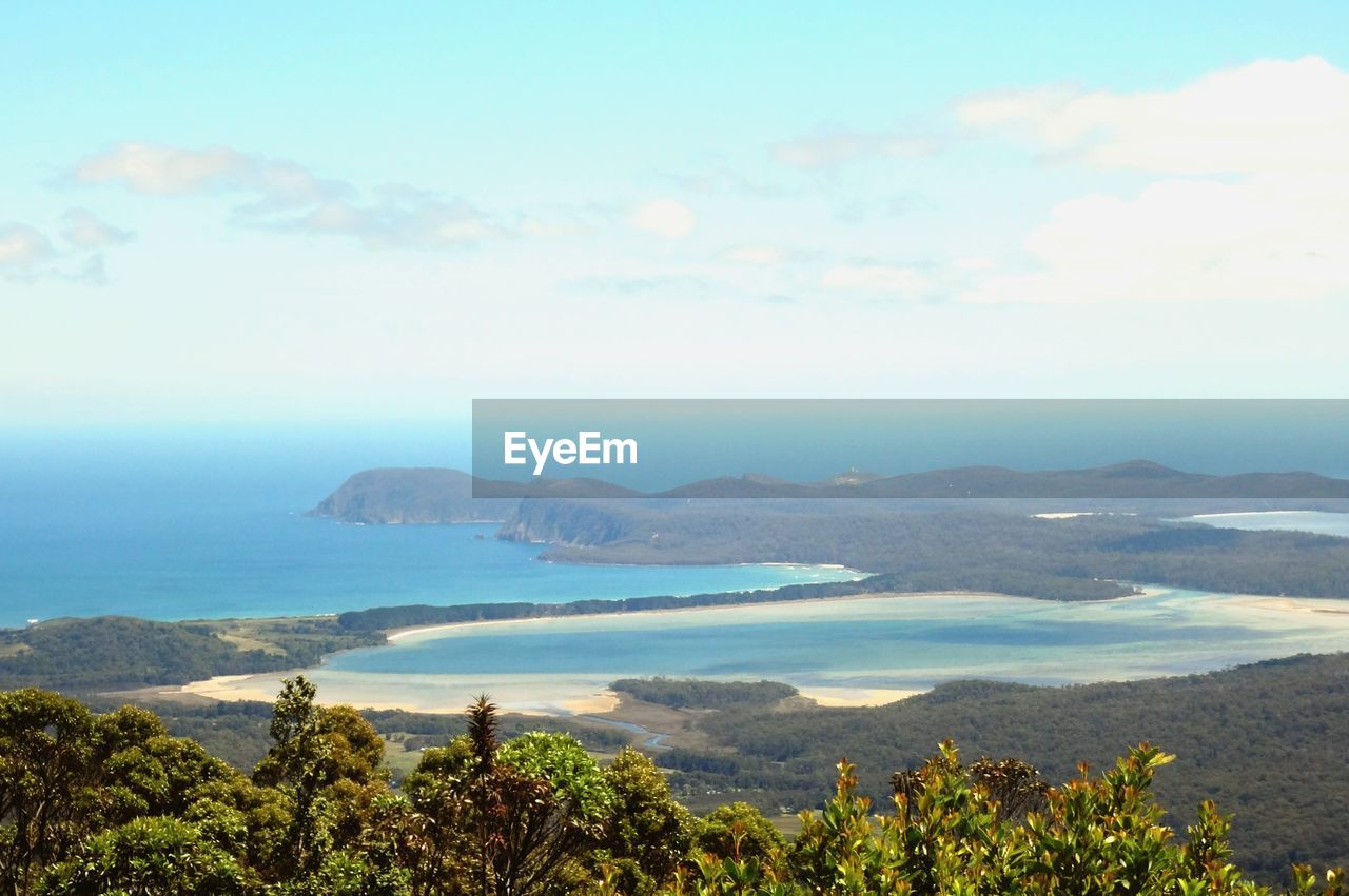 SCENIC VIEW OF SEA WITH MOUNTAINS IN BACKGROUND