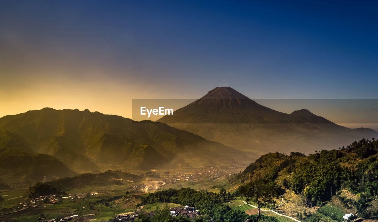 Scenic view of mountains against sky during sunset