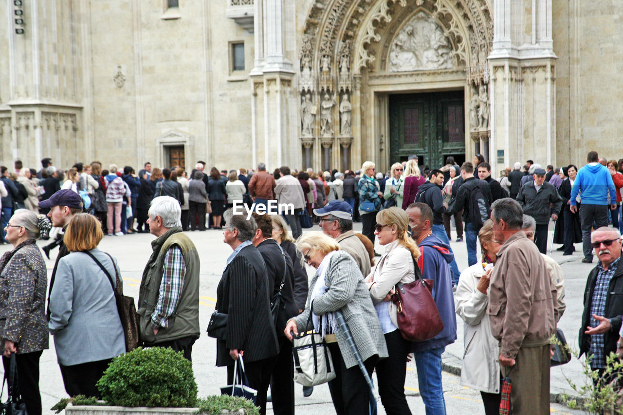 GROUP OF PEOPLE AT TEMPLE