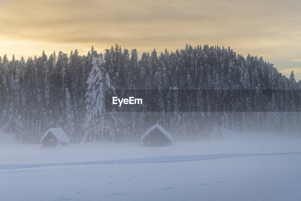 SNOW COVERED LAND AGAINST SKY